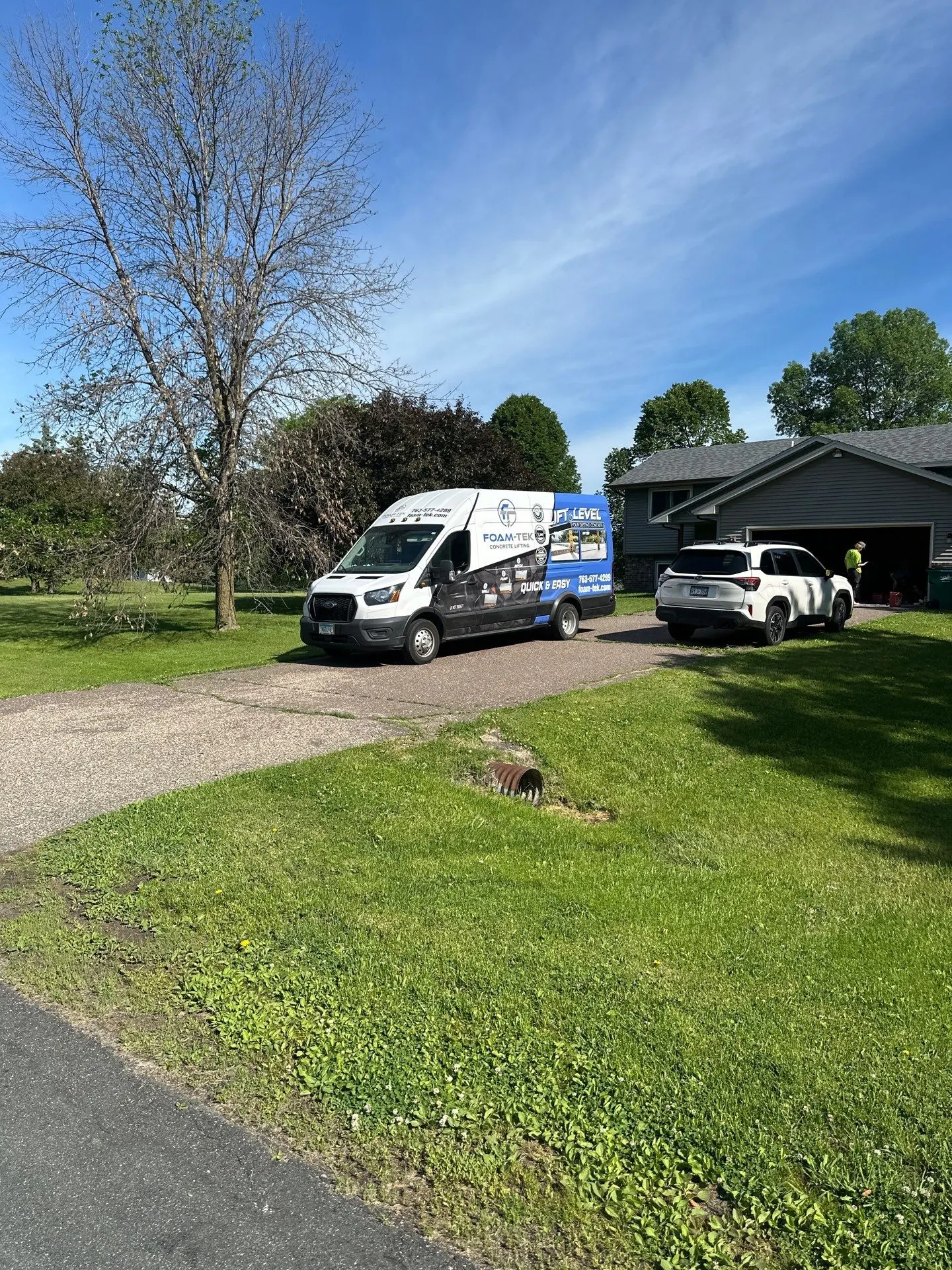Foam-Tek service van parked in a customer driveway
